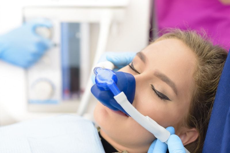 a woman receiving dental sedation